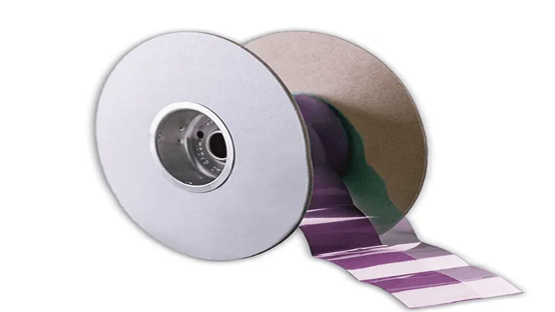 Image of Honeywell PTM7950 phase change material on a roll, illustrating its form factor for manufacturing and application, with a purple-colored surface.
