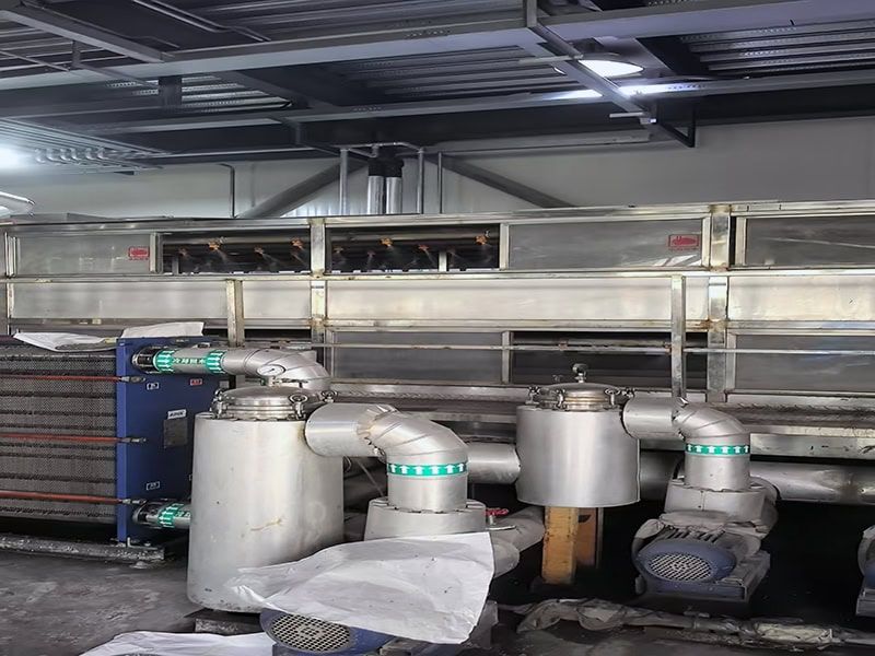 Modern EVA hot melt adhesive manufacturing facility featuring stainless steel processing equipment and automated systems.