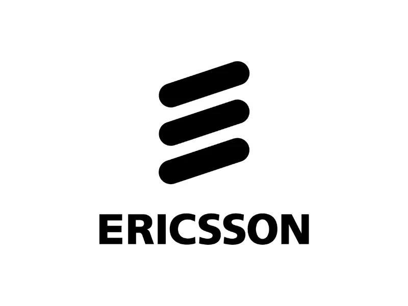 Worker handling electronic components with applied thermal interface material, highlighting precision in assembly or testing process.