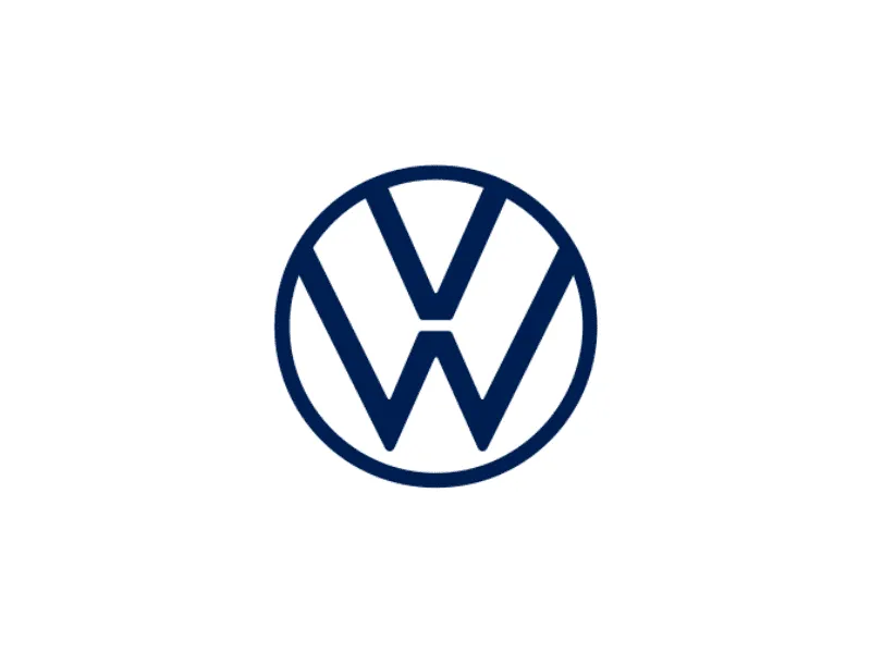 Technician operating equipment for applying thermal interface material onto industrial components in a controlled production environment.